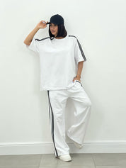 COORDINATO TUTA CON PROFILI LATERALI NEW SS25