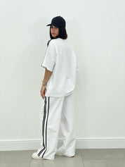 COORDINATO TUTA CON PROFILI LATERALI NEW SS25