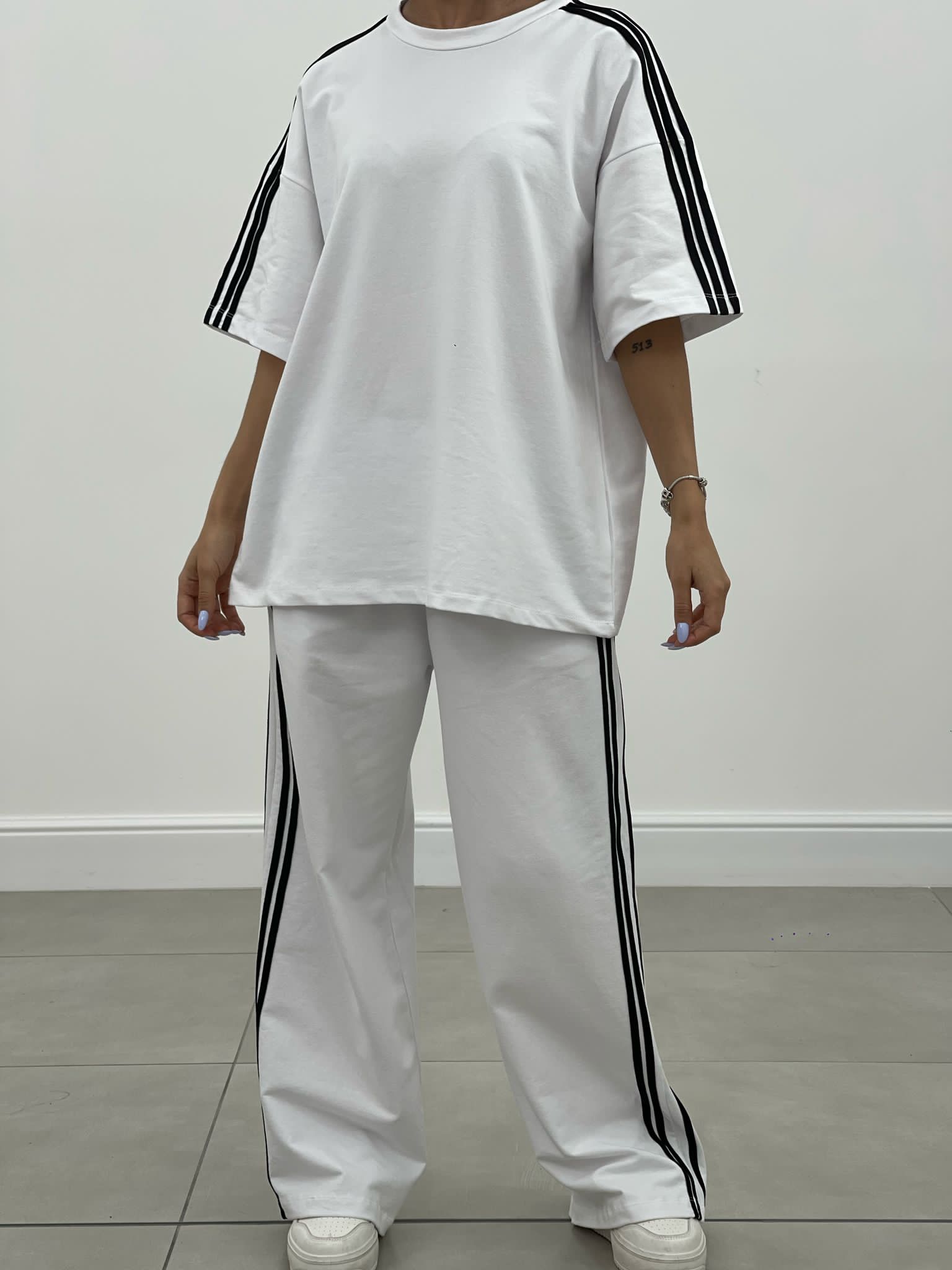 COORDINATO TUTA CON PROFILI LATERALI NEW SS25
