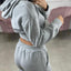 FELPA CROP CON ZIP E CAPPUCCIO
