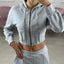 FELPA CROP CON ZIP E CAPPUCCIO