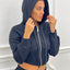 FELPA CROP CON ZIP E CAPPUCCIO